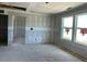 Living room featuring unfinished drywall, recessed lighting, and abundant natural light, awaiting your personal design at 59 Grove Township Way, Angier, NC 27501