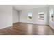 Bright living room with wood flooring and neutral walls, offering a blank canvas for personalization and comfortable living at 59 Grove Township Way, Angier, NC 27501