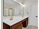 Bathroom with double sink vanity, granite countertop, black faucet, and a large mirror at 6101 Clarks Fork Dr, Raleigh, NC 27616