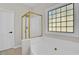 Bathroom with tub, shower, and a decorative window at 6101 Clarks Fork Dr, Raleigh, NC 27616