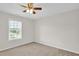 Bedroom with plush carpeting, natural lighting, and a ceiling fan at 6101 Clarks Fork Dr, Raleigh, NC 27616