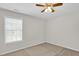 Bedroom featuring plush carpeting and natural light at 6101 Clarks Fork Dr, Raleigh, NC 27616