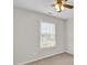 Neutral bedroom features include a window and a ceiling fan with light fixture at 6101 Clarks Fork Dr, Raleigh, NC 27616