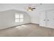 A spacious bedroom is adorned with a ceiling fan and is brightly lit by a window at 6101 Clarks Fork Dr, Raleigh, NC 27616