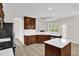 Well-designed kitchen with stainless steel appliances, white countertops, and a breakfast bar at 6101 Clarks Fork Dr, Raleigh, NC 27616