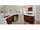 Open kitchen area with updated appliances, breakfast bar, and access to the outdoor patio at 6101 Clarks Fork Dr, Raleigh, NC 27616