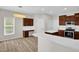 Modern kitchen featuring white countertops, stylish cabinetry, stainless steel appliances, and a breakfast nook at 6101 Clarks Fork Dr, Raleigh, NC 27616