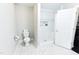This bright bathroom features white subway tile in the shower and a modern toilet with gray walls at 6409 Lakeland Dr, Raleigh, NC 27612