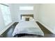 Bright bedroom with large window and comfortable bed setup at 6409 Lakeland Dr, Raleigh, NC 27612
