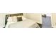 Bedroom featuring cozy bed with wooden headboard and warm lighting at 6409 Lakeland Dr, Raleigh, NC 27612