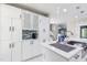 Updated kitchen featuring a large island with seating and stainless steel appliances at 6409 Lakeland Dr, Raleigh, NC 27612