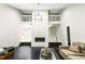 Modern living room with fireplace and white balcony overlook at 6409 Lakeland Dr, Raleigh, NC 27612
