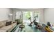 Cozy living room with sliding doors to outdoor deck and exercise equipment at 6409 Lakeland Dr, Raleigh, NC 27612