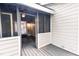 A tranquil screened-in porch offers relaxation and a seamless connection to the outdoors at 6409 Lakeland Dr, Raleigh, NC 27612