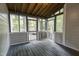 Enjoy the outdoors from this screened-in porch, seamlessly blending nature with comfortable living at 6409 Lakeland Dr, Raleigh, NC 27612