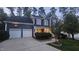Charming two-story home with a two-car garage and well-maintained landscaping at 709 Basil Dr, Durham, NC 27713