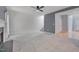 Inviting living room with fireplace, neutral carpet, and staircase access at 709 Basil Dr, Durham, NC 27713