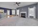Expansive living area with fireplace, open kitchen, and access to patio at 709 Basil Dr, Durham, NC 27713