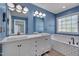 Stylish main bathroom features dual sinks, a bathtub, and modern fixtures at 709 Basil Dr, Durham, NC 27713