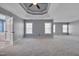 Expansive main bedroom boasts tray ceiling, fan, ensuite bathroom, and ample natural light at 709 Basil Dr, Durham, NC 27713