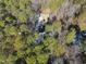 An aerial view of the home site surrounded by a beautiful tree line at 7218 Sunrise Rd, Chapel Hill, NC 27514