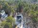 An aerial view shows the beautiful home site surrounded by a dense tree line at 7218 Sunrise Rd, Chapel Hill, NC 27514