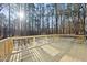 New wooden back deck overlooking a beautiful wooded backyard at 7218 Sunrise Rd, Chapel Hill, NC 27514