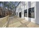 New wooden back deck on a house, overlooking a wooded backyard at 7218 Sunrise Rd, Chapel Hill, NC 27514