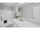 Well-lit bathroom features a shower-tub combo with a white quartz countertop and sleek vanity at 7218 Sunrise Rd, Chapel Hill, NC 27514