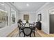Dining room with an oval table, six chairs, and a window overlooking the backyard at 7218 Sunrise Rd, Chapel Hill, NC 27514