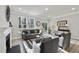 Sunlit living room with fireplace, deck access, and modern decor for comfortable living at 7218 Sunrise Rd, Chapel Hill, NC 27514