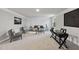 Spacious living room with neutral carpet, custom paneling, and stylish decor at 7218 Sunrise Rd, Chapel Hill, NC 27514