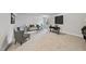 Spacious living room with neutral carpet, custom paneling, and stylish decor at 7218 Sunrise Rd, Chapel Hill, NC 27514
