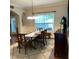 Bright dining room with a large window, rustic table, and cozy seating at 742 Keystone Park Dr, Morrisville, NC 27560