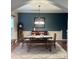 Elegant dining room with stylish decor, a rustic table, and a soft rug at 742 Keystone Park Dr, Morrisville, NC 27560