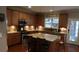 Spacious kitchen featuring an island, stainless steel appliances, and ample cabinet space at 742 Keystone Park Dr, Morrisville, NC 27560