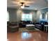 Cozy living room with hardwood floors, comfortable seating, and plenty of natural light at 742 Keystone Park Dr, Morrisville, NC 27560