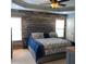 Serene main bedroom features unique wood accent wall, tray ceiling, and neutral carpeting at 742 Keystone Park Dr, Morrisville, NC 27560