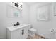 Stylish bathroom with a modern vanity, sleek fixtures, and neutral tile flooring at 7433 Deer Track Dr, Raleigh, NC 27613