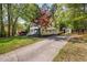 Two-story home with a long driveway and a well-manicured front yard at 7433 Deer Track Dr, Raleigh, NC 27613