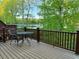 Relax on this backyard deck and enjoy the beautiful view overlooking the water at 8002 Upper Lake Dr, Raleigh, NC 27615