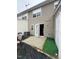 Back patio area with an opened door leading into the home at 8013 River Water Ct, Raleigh, NC 27616