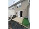 Exterior shot of a fenced in backyard with an opened door at 8013 River Water Ct, Raleigh, NC 27616