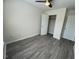 Bedroom featuring ceiling fan, closet, and hardwood flooring at 8013 River Water Ct, Raleigh, NC 27616