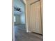 Bright bedroom with a ceiling fan, large window, and gray flooring at 8013 River Water Ct, Raleigh, NC 27616