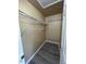 Walk-in closet featuring shelving and new floors at 8013 River Water Ct, Raleigh, NC 27616