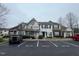 Inviting townhome featuring a well-maintained facade, neat landscaping, and dedicated parking spaces for residents and guests at 8013 River Water Ct, Raleigh, NC 27616