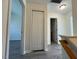 Upstairs hallway showcasing closet space and access to the bedroom at 8013 River Water Ct, Raleigh, NC 27616
