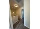 Bright hallway features hardwood flooring and leads to bedrooms and bathrooms at 8013 River Water Ct, Raleigh, NC 27616