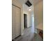 Hallway featuring a double door closet and access to multiple rooms at 8013 River Water Ct, Raleigh, NC 27616